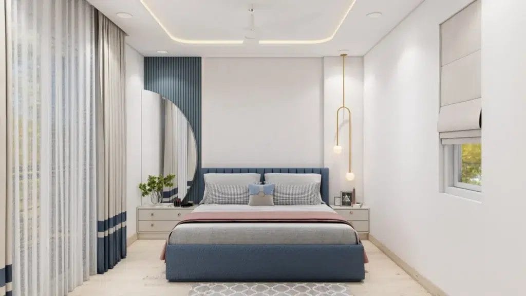 Modern bedroom featuring a blue bed, elegant decor, airy curtains, and stylish pendant lights, creating a cozy and inviting atmosphere.